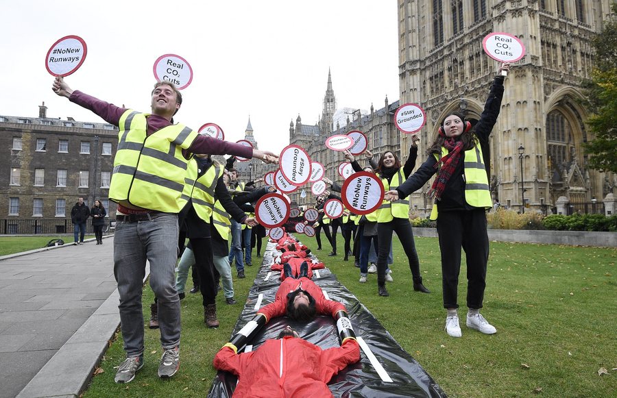  Protestors from Plane Stupid stage a demonstration with a mock runway outside the Houses of Parliament in London, Britain, 25 October 2016. The UK government is expected to announce the long-awaited decision on airport expansion, with Heathrow running as the favourite.  EPA/FACUNDO ARRIZABALAGA