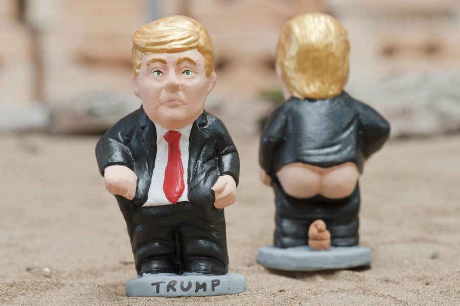 epa05617669 A traditional Christmas little sculpture called 'caganers' (lit. defecators) picturing US presidential candidate Donald Trump were launched by the brand caganer.com in the town of Torroella de Montgri, Catalonia, northeastern Spain, 04 November 2016. The 'caganer' is a traditional figure in Catalonian nativity scenes.  EPA/ROBIN TOWNSEND