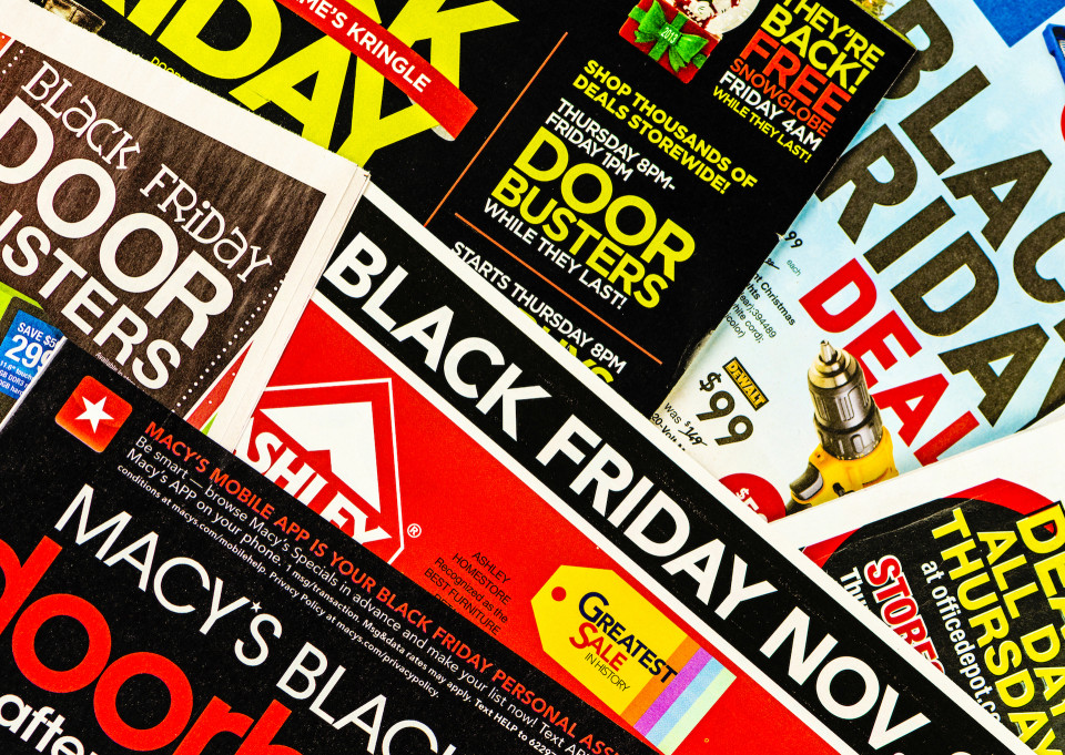 Suffolk, Virginia, USA - November 28, 2013: A square format studio shot of a collection of American retailers' sales flyers and brochures advertising the Black Friday Sales and specials for November 29th, 2013.