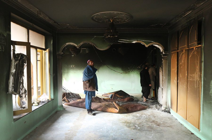 epa05685219 A person inspects the remains of his belongings at the house of Mir Wali, a member of parliament from Helmand province, after a late-night attack in western Kabul, Afghanistan, 22 December 2016. Three gunmen stormed Helmand MP Mir Wali's house in Khoshal Khan, in Kabul on 22 December, killing at least eight people, including two children and leaving the parliamentarian wounded after he jumped from a roof to escape, according to reports.  EPA/HEDAYATULLAH AMID