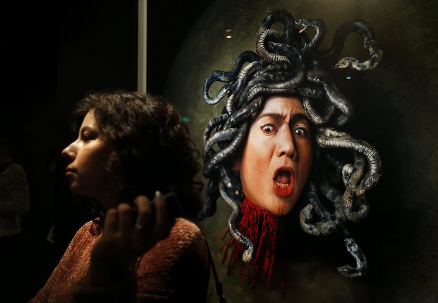 epa05761699 A visitor stands in front of the color photograph 'Caravaggio. Medusa's Scream' during press preview of the exhibition of Japan artist Yasumasa Morimura 'The history of the self-portrait solo' in The Pushkin State Museum of Fine Arts in Moscow, Russia, 30 January 2017. The exhibition shows more then 80 pieces from the collection of The National Museum of Art in Osaka, Hara Museum of Contemporary Art in Tokyo, The National Museum of Modern Art in Kyoto, and from the collection of Yasumasa Morimura.  EPA/YURI KOCHETKOV