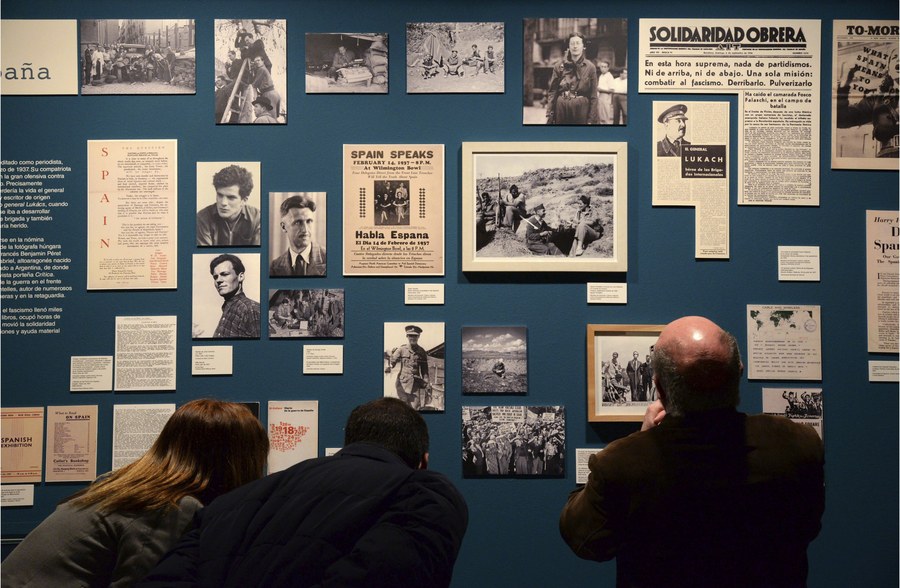 epa05796713 Visitors looks at photographs and documents displayed during the press preview of the exhibition 'Orwell haves coffee in Huesca' at the Museum of Huesca, Spain, 16 February 2017. The event devoted to British writer George Orwell will run from 17 February to 25 June 2017.  EPA/JAVIER BLASCO
