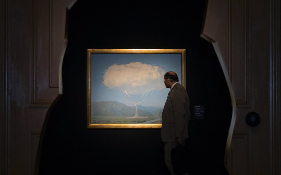 epa05812370 A visitor looks at the painting 'La corde sensible' (1960) by Belgian surrealist artist Rene Magritte (1898-1967) during a preview event at Christie's auction house in London, Britain, 24 February 2017. The artwork is estimated to fetch between 14-18 million British pounds (18-23 million US dollars) and will be sold at Christie's Impressionist and Modern Art Evening Sale auction on 28 February 2017.  EPA/HAYOUNG JEON