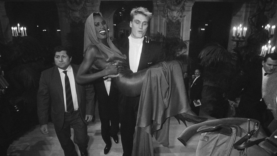Lundgren carries then-girlfriend Grace Jones to a fashion awards show in Paris in October 1985.