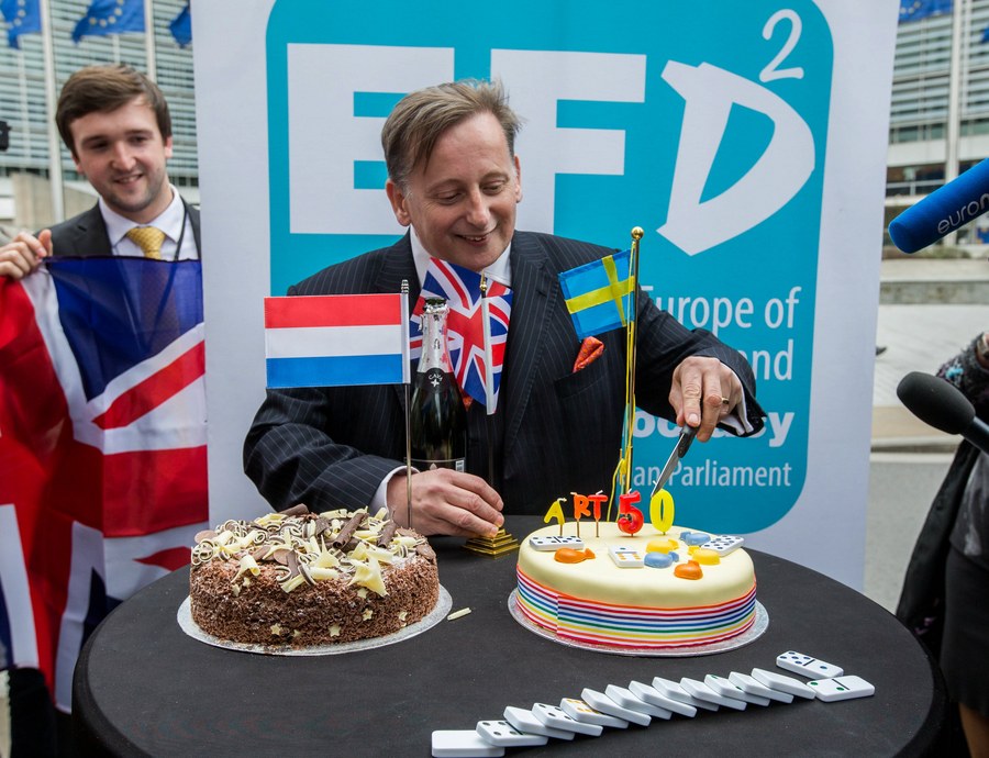 epa05877070 Britain's UK Independence Party (UKIP) MEP Ray Finch (C) cuts a cake as UKIP members celebrate the official triggering of Article 50 of the Lisbon Treaty, dubbed 'Brexit', at the Old Hack Pub in front of the EU Commission in Brussels, Belgium, 29 March 2017. Others are not identified. The British ambassador to the EU, Sir Tim Barrow, earlier 0n n29 March handed over the official notice under Article 50 of the Lisbon Treaty to European Council President Donald Tusk as part of the process that starts the formal proceedings of the United Kingdom leaving the European Union. Britain's Prime Minister had signed the notice following the June 2016 referendum to vote on Britain staying or leaving the European Union.  EPA/STEPHANIE LECOCQ